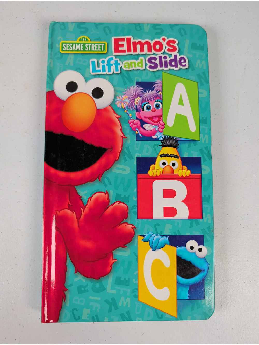 Sesame Street Elmo's Lift and Slide ABC Board Book
